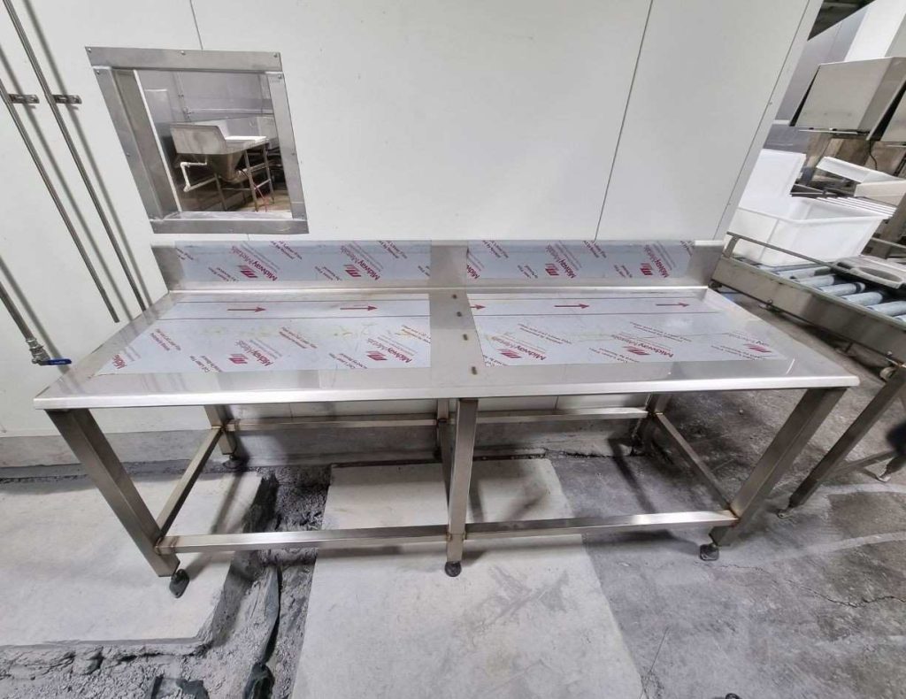 Custom stainless steel table fabricated for abattoir processing facility