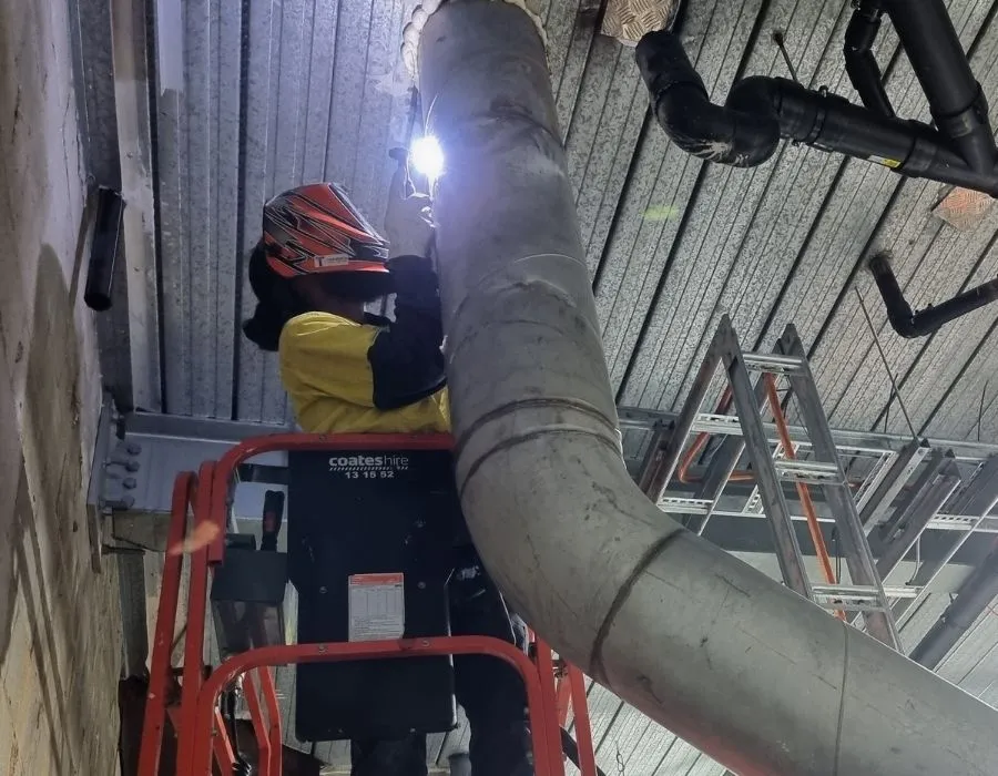Topweld welder fabricating industrial HVAC ducting inside abattoir processing facility Leeton, NSW