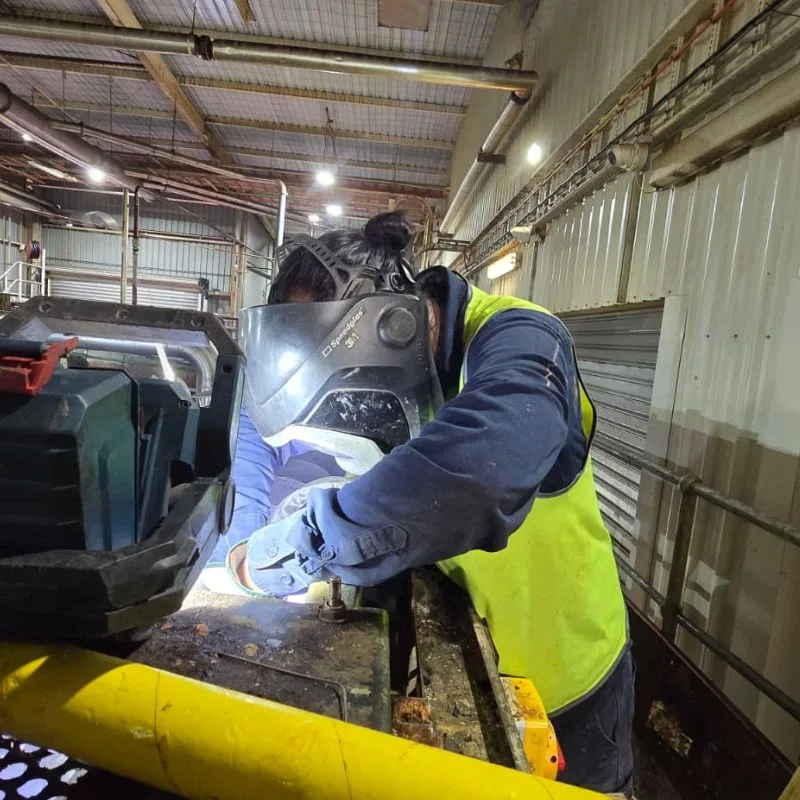 Topweld welder performing on-site stainless steel repair inside an abattoir facility in Griffith, NSW